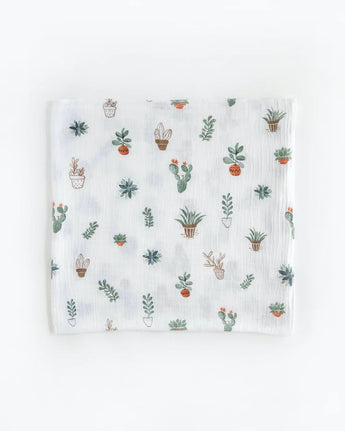 Little Unicorns Cotton Swaddle Set in Bison features a breathable white muslin cloth with a cute cactus and potted plant design.