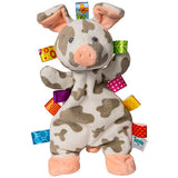 Lovey, Patches Pig by Mary Meyer is a plush pig toy with patchy design and Taggies ribbons, featuring embroidered eyes. Ideal baby gift!.