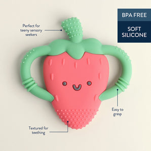 The Itzy Ritzy Chew Crew Strawberry teether, BPA free with a smiling face and textured bottom, is perfect for soothing sore gums.