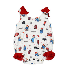 Lovedbabys Organic Bowtie Bodysuit features a white design with red bows, a cartoon bear, phones, buses & Paddington text.