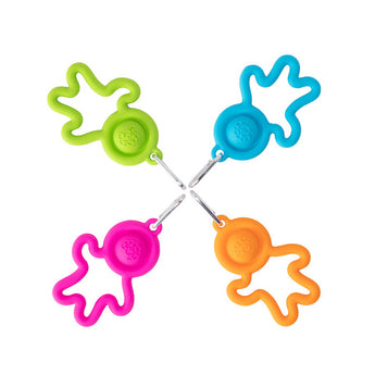 Four Lil Dimpl Keychains by Fat Brain Toy Co: star-shaped silicone bag hangers with rings in pink, green, blue, and orange.