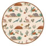 The Emerson and Friends Bamboo Blanket, Desert Friends boasts a circular pattern of armadillos, rabbits & desert flora on beige.