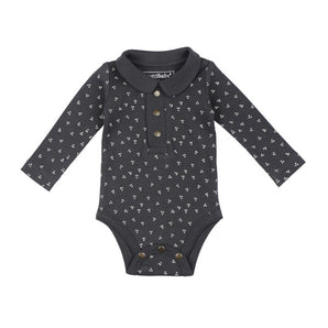 Charcoal dots organic cotton bodysuit with long sleeves and button closures, part of the Lovedbaby collection.