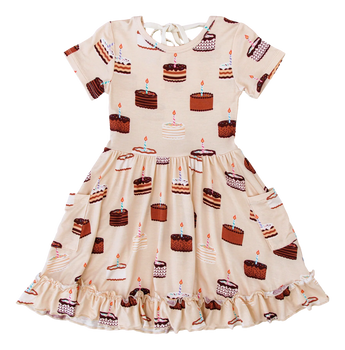Blake Birdie Dress by Birdie Bean in bamboo viscose, cake pattern with chocolate and vanilla cakes, short sleeves, ruffled hem.