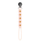 LouLou Lollipops Daisy Cream pacifier clip is beadless, BPA-free silicone, with a floral chain design for easy attachment.