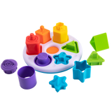 The Plugzy Shape Learning Toy by Fat Brain Toy Co boosts sensory learning with shapes and slots on a white circular base.