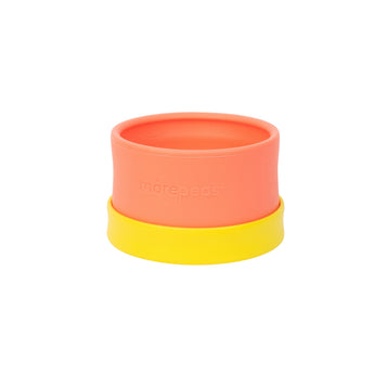 Morepeas Essential Snack Bowl in orange silicone with a yellow suction base, displayed on a white background.