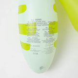 Close-up of safety warnings and batch info on Sunnylifes Monty the Monster, a lime-accented white inflatable pool noodle for kids.