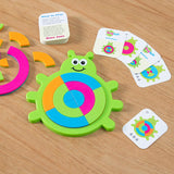 The Bugzzle Game by Fat Brain Toy Co features colorful bug-shaped puzzle pieces and instruction cards for a playful brain challenge.