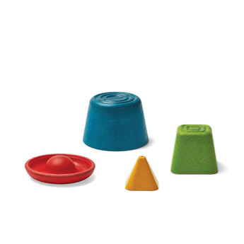 Colorful geometric shapes for creative play: blue cylinder, red disk/dome, yellow cone, and green prism from PlanToys Creative Sand Play.