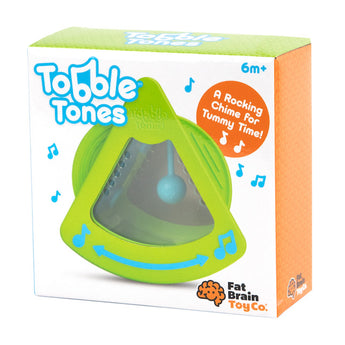 The Tobble Tones by Fat Brain Toy Co features a green triangle toy with a chime ball for sensory and motor skills. For ages 6m+.