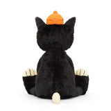 Jellycats Jack Huge is a plush tuxedo cat toy with an orange pumpkin hat, sitting with its back to the viewer.