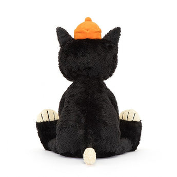Jellycats Jack Huge is a plush tuxedo cat toy with an orange pumpkin hat, sitting with its back to the viewer.