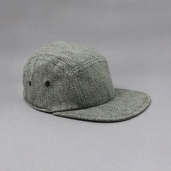 Storied Hats Lil Hat, Tuxedo: Tweed gray baseball cap with flat brim for sun protection, shown side/front on gray background.