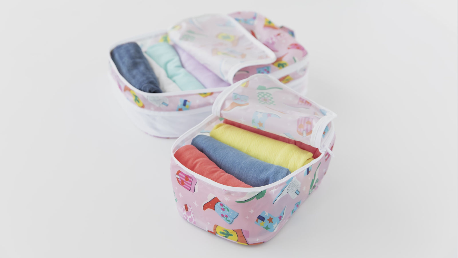 Bumkins Packing Cubes fit clothes, accessories, and more for travel, and are made from Bumkins signature waterproof fabric for easy cleaning.
