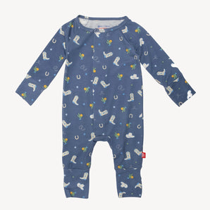 Magnetic Me, Coverall Rodeo Blue: A blue baby onesie with cowboy hats, boots, horseshoes & cacti. Long sleeves in eco-friendly TENCEL™ modal.