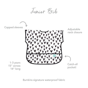 Bumkins Junior Bib: Hearts features capped sleeves, stain-resistant fabric, adjustable neck closure, and catch-all pocket for ages 1-3.