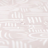 Close-up of water droplets on Bumkins Splat Mat: Wander.