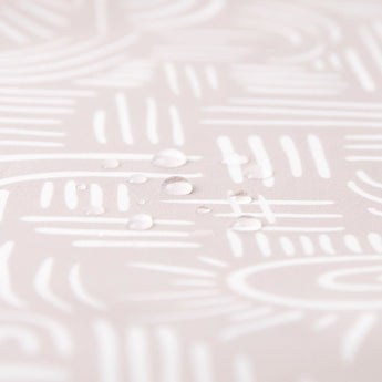 Close-up of water droplets on Bumkins Splat Mat: Wander.