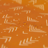 Close-up of water droplets on an orange Bumkins Reusable Snack Bag, Small 2-Pack: Sunshine and Grounded.