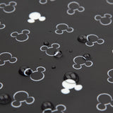 A Clear Travel Bag 3-Pack by Bumkins features a Mickey Mouse icon pattern in black and white with water droplets.