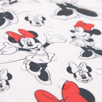 Bumkins Junior Bib features Minnie Mouse with red bows on a stain-resistant, easy-wipe fabric, against water droplets on white.