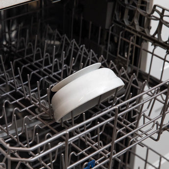 Bumkins Silicone Grip Bowl: Marble sits in the top rack of an open dishwasher.