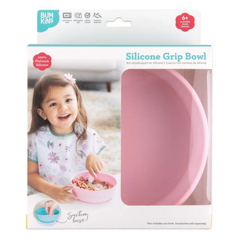 Bumkins Silicone Grip Bowl: Pink in a white packaging box with a photo of a child and a clear window partially displaying the bowl.