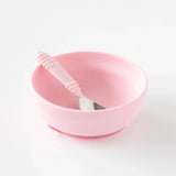 Bumkins Silicone Grip Bowl: Pink sits with a pink spoon inside on a white background.