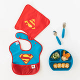 Bumkins baby bib set with superhero logo, utensil set, and a Dark Blue Silicone Grip Dish for toddler meals and snacks.