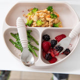 Close-up of Bumkins Silicone Grip Dish: Sand with couscous, broccoli, green beans, and berries, alongside a spoon and fork.