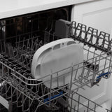 Open dishwasher with Silicone Grip Dish: Gray by Bumkins on the tray, featuring a food-safe silicone design. Kitchen counter in background.