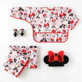 Bumkins Disney Little Ones Gift Bundle: Minnie Mouse Classic includes a sleeved bib, Silicone Chewtensils®, splat mat, and silicone grip dish.
