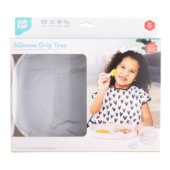 Bumkins Silicone Grip Tray: Marble in a white packaging box with a photo of a child and a clear window partially displaying the dish.