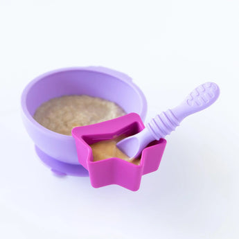 A Bumkins Silicone Little Dipper 3-Pack: Lollipop with a spoon, attached to a purple bowl on a white background.
