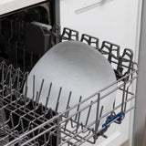 Bumkins Silicone Sensory Placemat: Marble sits in the top rack of an open dishwasher.