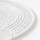 Close-up of Bumkins Silicone Sensory Placemat: Marble on a white background.