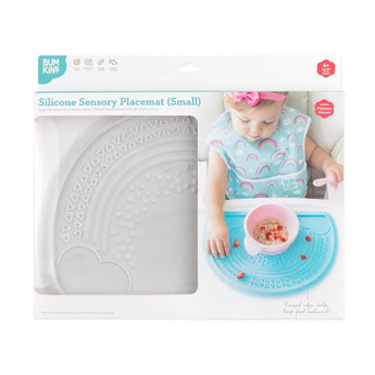 Bumkins Silicone Sensory Placemat: Marble is shown in a packaging box with a photo of a child and a window partially showing the placemat.