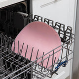Bumkins Silicone Sensory Placemat: Pink sits in the top rack of an open dishwasher.