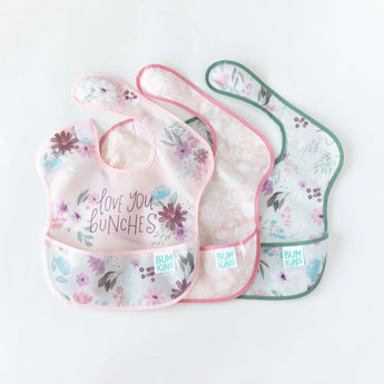 Bumkins SuperBib® 3 Pack: Love You Bunches features three floral bibs with adjustable fit and pockets.