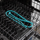 Bumkins Silicone Accessory Tether 2-Pack: Blue sits in the top rack of an open dishwasher.