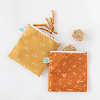 Bumkins Reusable Snack Bag, Large 2-Pack: Sunshine and Grounded on a white background, filled with pretzels and flower-shaped sandwiches.