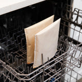 Bumkins Reusable Snack Bag, Large 2-Pack: Sunshine and Grounded sits in the top rack of an open dishwasher.