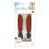 Bumkins Spoon + Fork: Clay is shown in a white packaging box with a clear front window displaying the set of utensils.