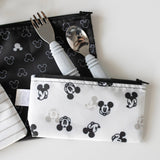 The Spoon + Fork: Gray set by Bumkins comes in two Mickey Mouse fabric pouches, featuring a toddler silicone fork and spoon.