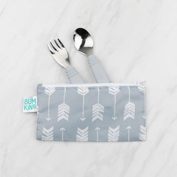 Bumkins Spoon + Fork: Gray toddler utensil set with white arrows on a gray pouch, displayed on white marble.