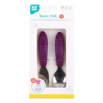 Bumkins Spoon + Fork set in purple, features wide handles for easy toddler feeding, packed in a box.