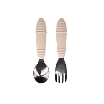Bumkins Spoon + Fork: Sand, made from food-safe silicone, features beige textured handles and stainless steel heads.