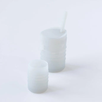 Bumkins Silicone Starter Cup: Gray sits in front of a larger gray cup on a white background.