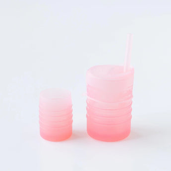 Bumkins Silicone Starter Cup: Pink sits next to another pink cup on a white background.
